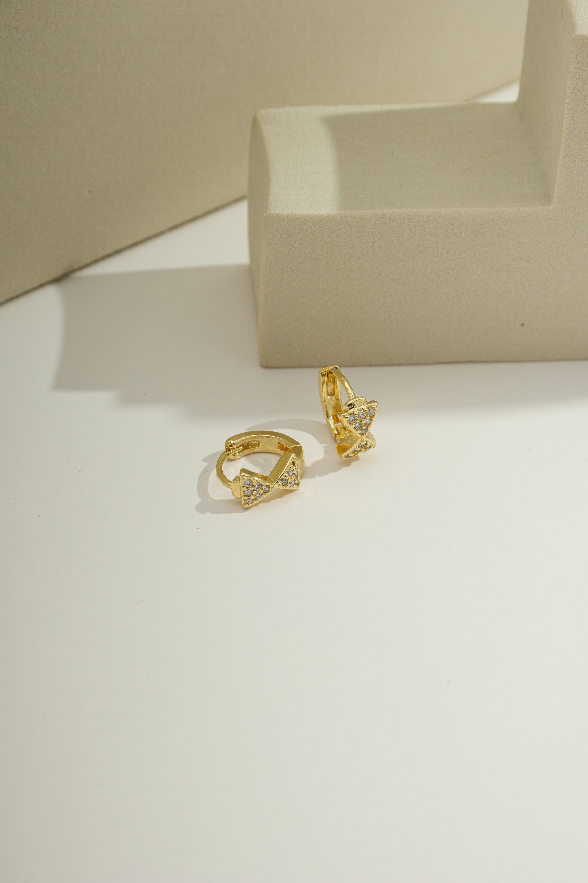 Dainty Pavé Bow Huggies Gold